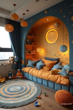 a child's bedroom decorated in blue and orange with stars on the ceiling, moon - shaped windows, and round rug