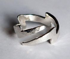 "The Lightning Bolt symbolizes many things to people in different world cultures: honesty, fertility, strength, intellect, illumination..union of fire and water, power, swiftness, just to name a few...To me, it symbolizes sudden divine inspiration, truth & energy. I love this symbol! Cast in solid Sterling Silver with a hammered finish, this wrap-around ring can be adjusted to fit US sizes 4-9. This is a variation of my original lightning bolt ring but has 2 tapered ends, instead of 1 wide a Bolt Rings, Lightning Ring, Lightning Scar, Lightning Bolt Ring, Silver Shark, Sterling Silver Cat, Silver Cat, Lightning Bolt, World Cultures