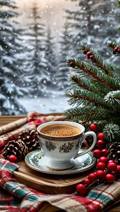 a cup of coffee sitting on top of a saucer next to a christmas tree