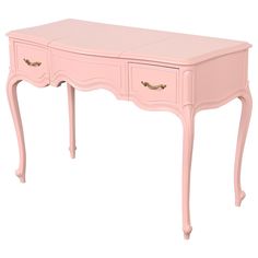 a pink desk with two drawers and gold trimmings on the bottom half of it