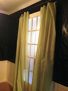 an open window in a room with black walls