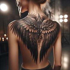 the back of a woman's body with wings on it