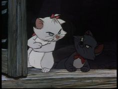 the cat and mouse are standing next to each other in disney's animated movie