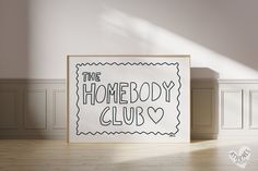 a sign that says the homeboy club on it in front of a white wall