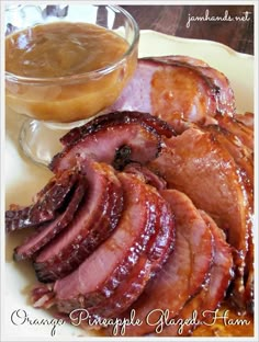 sliced bacon on a plate next to a bowl of sauce