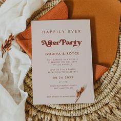 a party card sitting on top of a woven basket next to an orange and white napkin