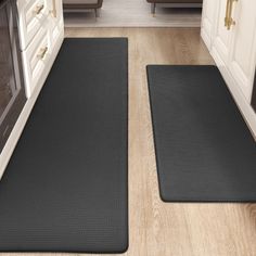 two mats on the floor in a kitchen