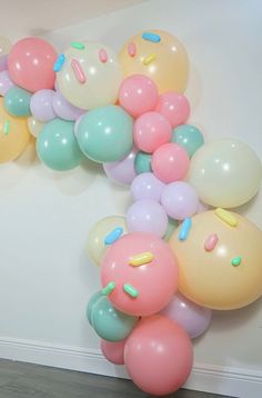 a bunch of balloons that are on the wall