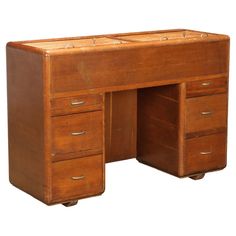 an old fashioned wooden desk with drawers