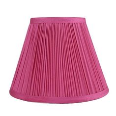 a pink pleated lamp shade on a white background