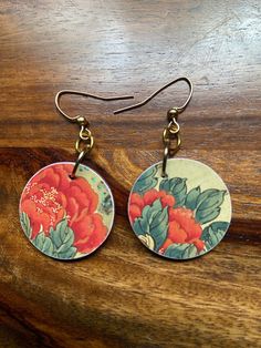 These handmade decoupage earrings feature beautiful wood block prints of flowers. Each earring is adorned with a matching glass bead. Ear wires are nickel free. Shrinks Dink, Decoupage Earrings, Wood Block Prints, Czech Beads Jewelry, Japanese Block Print, Wood Block Printing, Print Flower, Czech Beads, Hand Made Jewelry