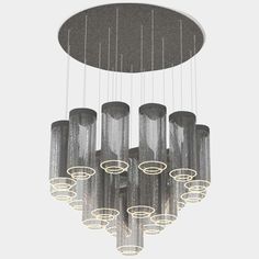 a chandelier with eight lights hanging from it's center and six circular glass tubes