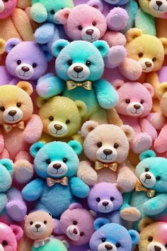 there are many different colored teddy bears together