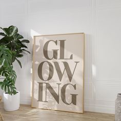 a plant is sitting next to a sign that says gl owling