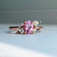 a close up of a pink ring on a table