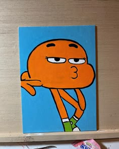 an orange cartoon character painted on a blue background