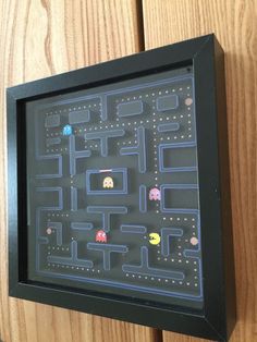 a framed video game with pacman on it