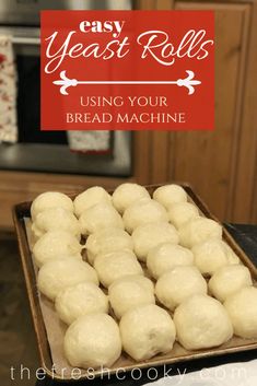 some food that is sitting on a tray in front of a stove and microwave with the words easy yeast rolls using your bread machine