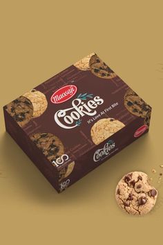 a box of cookies next to a chocolate chip cookie