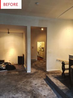 an empty living room is shown with no furniture on the floor and carpeted floors