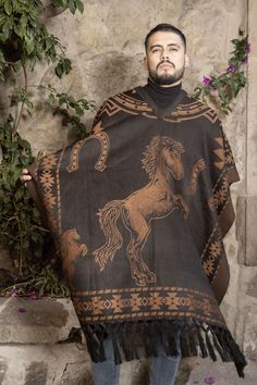 Step into the heart of Mexico's cultural heritage with our traditional men's poncho. Expertly crafted with a blend of authenticity and comfort, this poncho is a celebration of timeless craftsmanship. The earthy tones and intricate patterns reflect the rich artistic traditions of Mexican culture, offering a stylish nod to the country's vibrant history.  Embrace the spirit of Mexico with this classic piece that effortlessly merges heritage and style. Made out Acrylic, non-itchy material.  One size Traditional Brown Winter Cape, Traditional Brown Poncho For Festival, Traditional Brown Shawl Poncho, Poncho Winter, Mens Poncho, Mexican Men, Winter Shawl, Cowboy Style, Mexican Culture