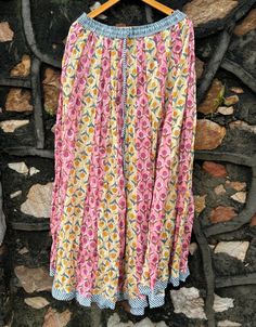 Beautifully block printed and handmade cotton skirt. New Fashion Skirt Floral Print Beach Boho Maxi Dress. Cotton Fabric Traditional Screen Print Tribal Women's Long Wrap Maxi Skirt Material - 100% Cotton Pattern - Floral Print Style - Indian Warp Skirt Color - Multi Color  Size - Long Skirt Length - 38 Inches Waist Unstretched - 25 Inches Waist Stretched - 40 Inches Suitable for any party, festival or beach wear, casual house wear. These skirts are unique traditional prints, versatility, comfor Traditional Beach Skirt, Traditional Long Skirt For Beach, Traditional Long Beach Skirt, Multicolor Printed Long Skirt, Summer Cotton Bottoms With Printed Motifs, Traditional Beach Skirt With Lining, Bohemian Cotton Maxi Skirt For Festivals, Traditional Lined Skirt For Beach, Traditional Cotton Skirt For The Beach