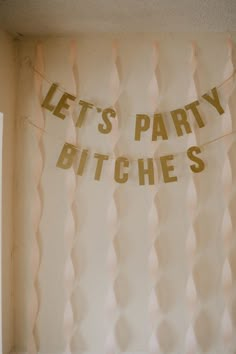 there is a party banner hanging on the wall