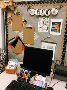 an office desk with a computer and lots of school supplies