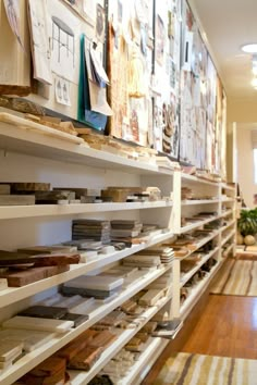 the shelves are full of books and magazines