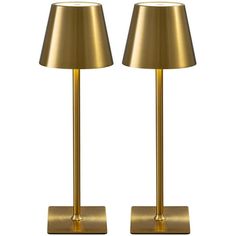 pair of brass lamps on white background