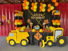 a construction themed birthday party with balloons and decorations