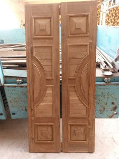 two wooden doors sitting next to each other