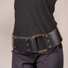 Details of a Wide leather hip big buckle studded rivets belt: Width 3.5" (8 cm) Hardware: Metal, three colors for your choice Adjustment: Adjustable for different hip levels PLEASE NOTE! You need to choose the size according to the size of the waist. The size of the belt will be calculated according to the proportions of the waist and hips. Waist measurements in inches and centimeters: XS (0-2) 24"-25" (61-64cm) S (4-6) 26"-27" (66 - 69 cm)  M (8-10) 28"-29" (71-74 cm)  L (12-14) 30"-32" (76-82 cm)  XL (16-18) 33"-35" (84-89 cm)  0X (16W) 36" (92 cm)  1X (18W-20W) 37"-39" (94-99cm)  2X (22W-24W) 41"-43" (104-109cm)  3X (26W) 45" (114cm) ALSO: The range of genuine leather is constantly updated. In addition, there are always 1-2 piece's of leather available that are not represented in my sho Big Belt, Alt Fashion, Suspender Belt, Wide Belt, Rivets, Natural Leather, Suspenders, Corsets, Unique Colors