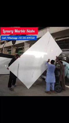 people working on an airplane in a factory