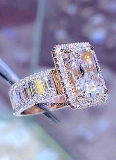 an engagement ring with two different colored stones