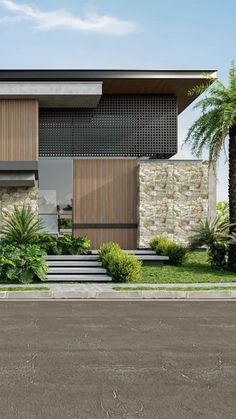 a modern house with palm trees and landscaping