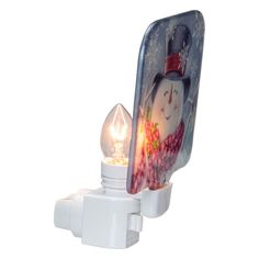 a white light with a snowman on it and a christmas ornament in the shape of a phone holder