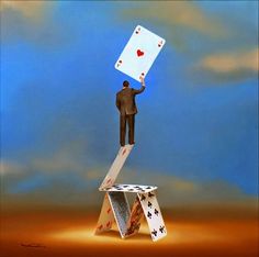 a man standing on top of two playing cards