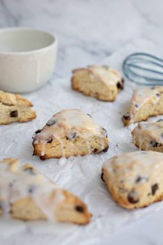 chocolate chip cookies with icing on parchment paper