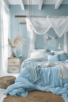 a bedroom with blue walls, white curtains and a canopy bed in the middle of it