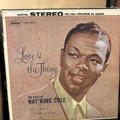 an album cover for love is the thing with nat king cole on it's front