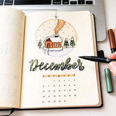 an open notebook with the word december written on it