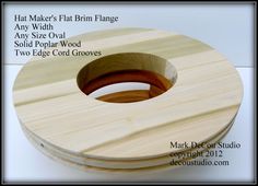 two wooden discs are stacked on top of each other, with the words that maker's plan in them