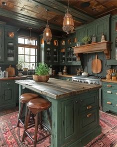 an old fashioned kitchen with green cabinets and wooden counter tops, two stools in front of the island