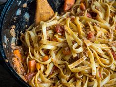 pasta with meat and vegetables in a skillet, ready to be cooked for dinner