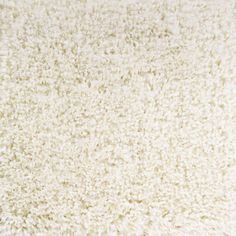 a close up view of a white carpet