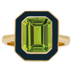 From our Aurora Collection, this stunning Peridot and Navy Enamel Ring takes inspiration from Bright Green and Dark Blue naturally occurring light display known as the Aurora Borealis. As one of the more common colour combinations of the Aurora Borealis, this was one of the first designs finalised for the Aurora Collection. We knew that the perfect stone to feature in this ring would be Peridot, the refreshing green colour is exactly what we wanted to use to embody the ribbons of light. The Navy enamel provides the perfect backdrop for this gorgeous stone, creating a vibrant ring perfect for dinner parties! Available in three settings, Yellow Gold Vermeil, 9ct Yellow Gold and 14ct Yellow Gold, this Cocktail Ring would make a fabulous addition to your Jewellery Collection. Boasting a centra The Aurora Borealis, Luxury Jewelry Brands, June Birthstone Jewelry, The Aurora, Enamel Ring, Green Peridot, Jewelry Ring Box, Pearl Jewellery Earrings, Men's Jewelry Rings