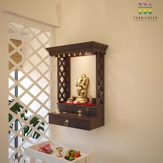 a small wooden shrine in the corner of a room next to a table with fruit on it