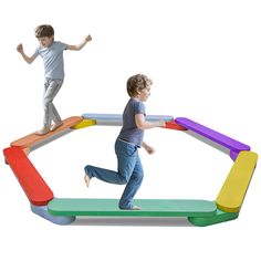 two children are playing on an inflatable structure with one child running and the other jumping