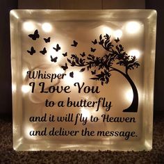 a lighted sign with butterflies on it that says whisper i love you to a butterfly and it will fly to heaven and deliver the message